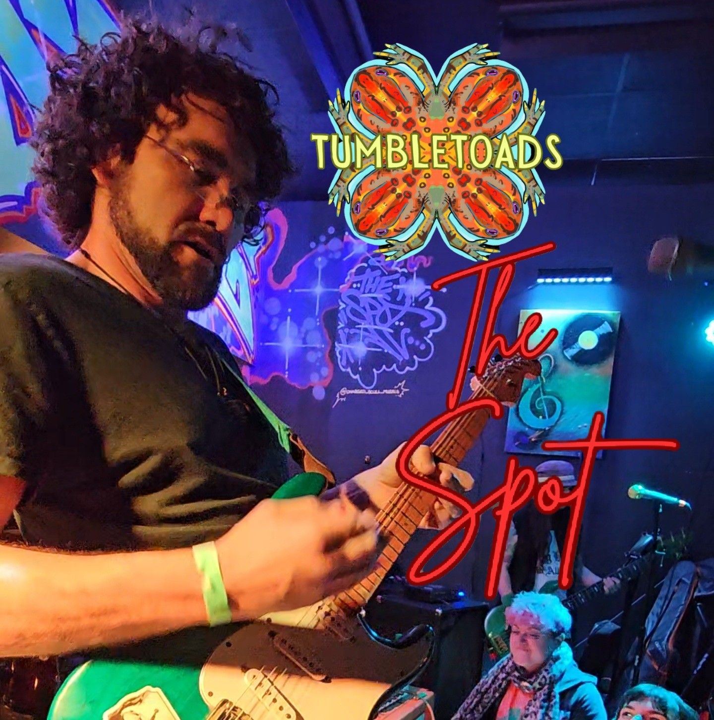 Guitar player performing at The Spot